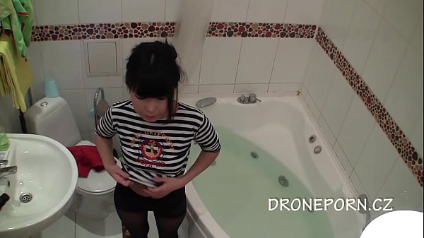 Sexy Asian girl pleasures herself passionately in steamy bathroom